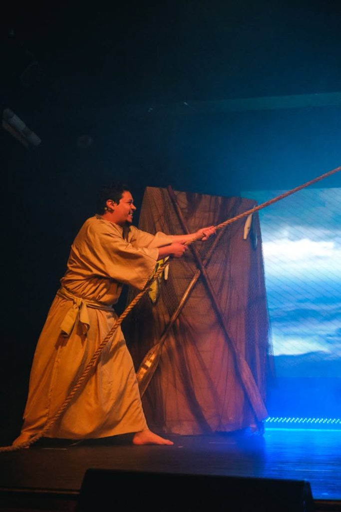 Matthew Sanchez delivering a powerful acting performance on stage, using physical storytelling and professional technique.